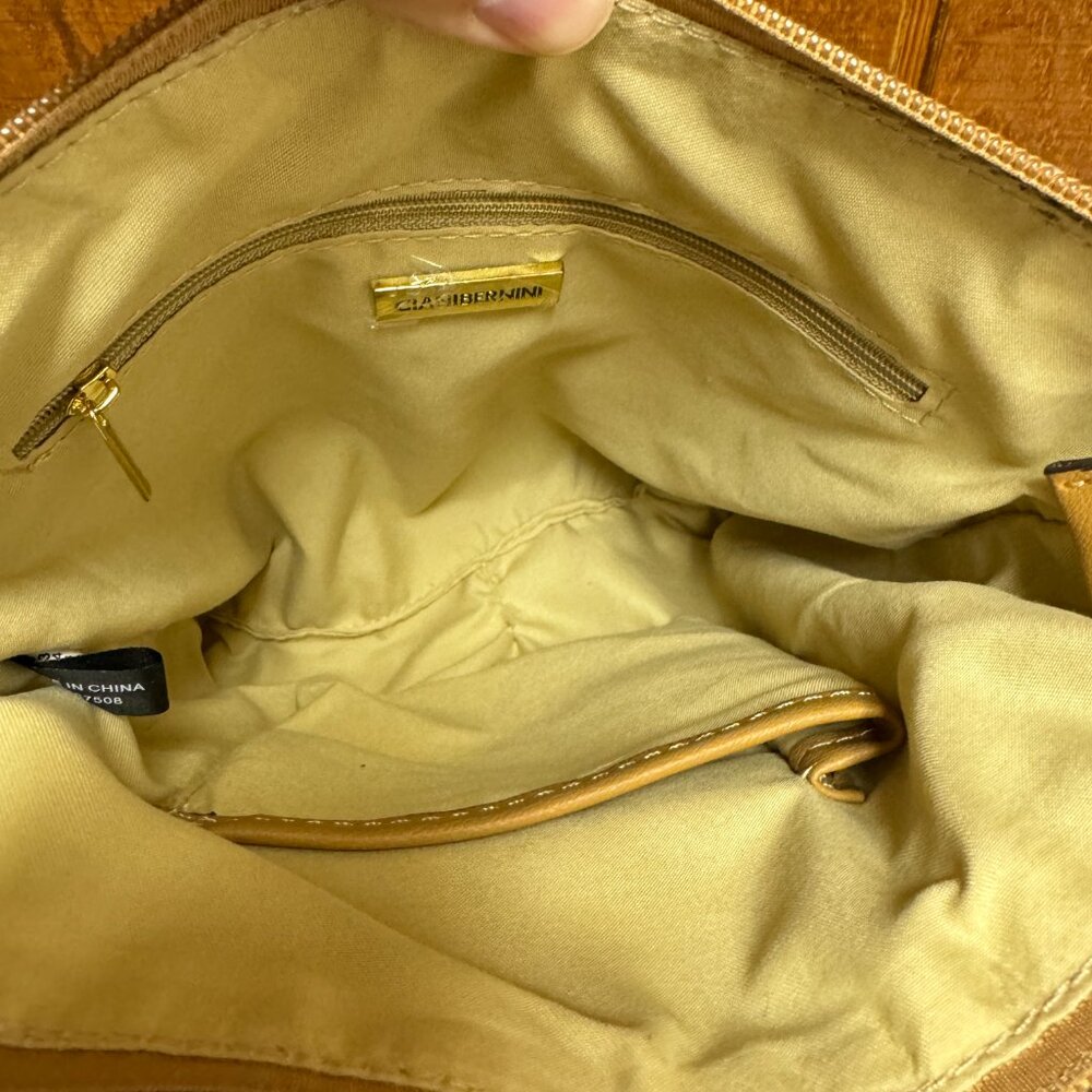 Small sized bag; 9"W x 9-3/4"H x 2"D 24"L adjustable strap Zippered closure Gold - Picture 3 of 5